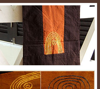 橙色の上に施された刺繍は渦巻きのような模様。素朴な可愛さを感じるデザインです。