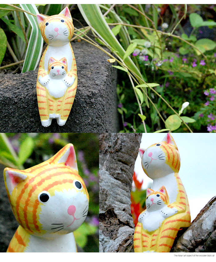 木彫りならではの素朴で温かみが伝わるネコのオブジェ。
