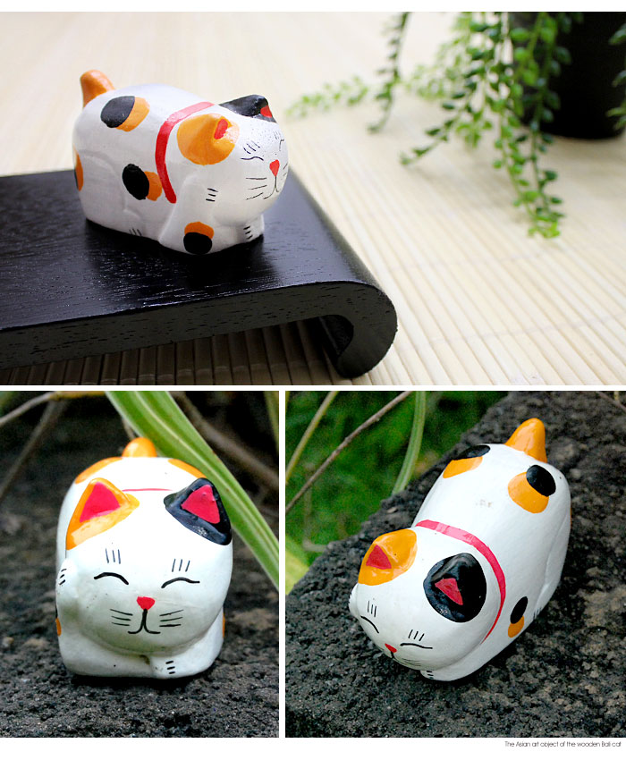 木彫りならではの素朴で温かみが伝わるネコのオブジェ。